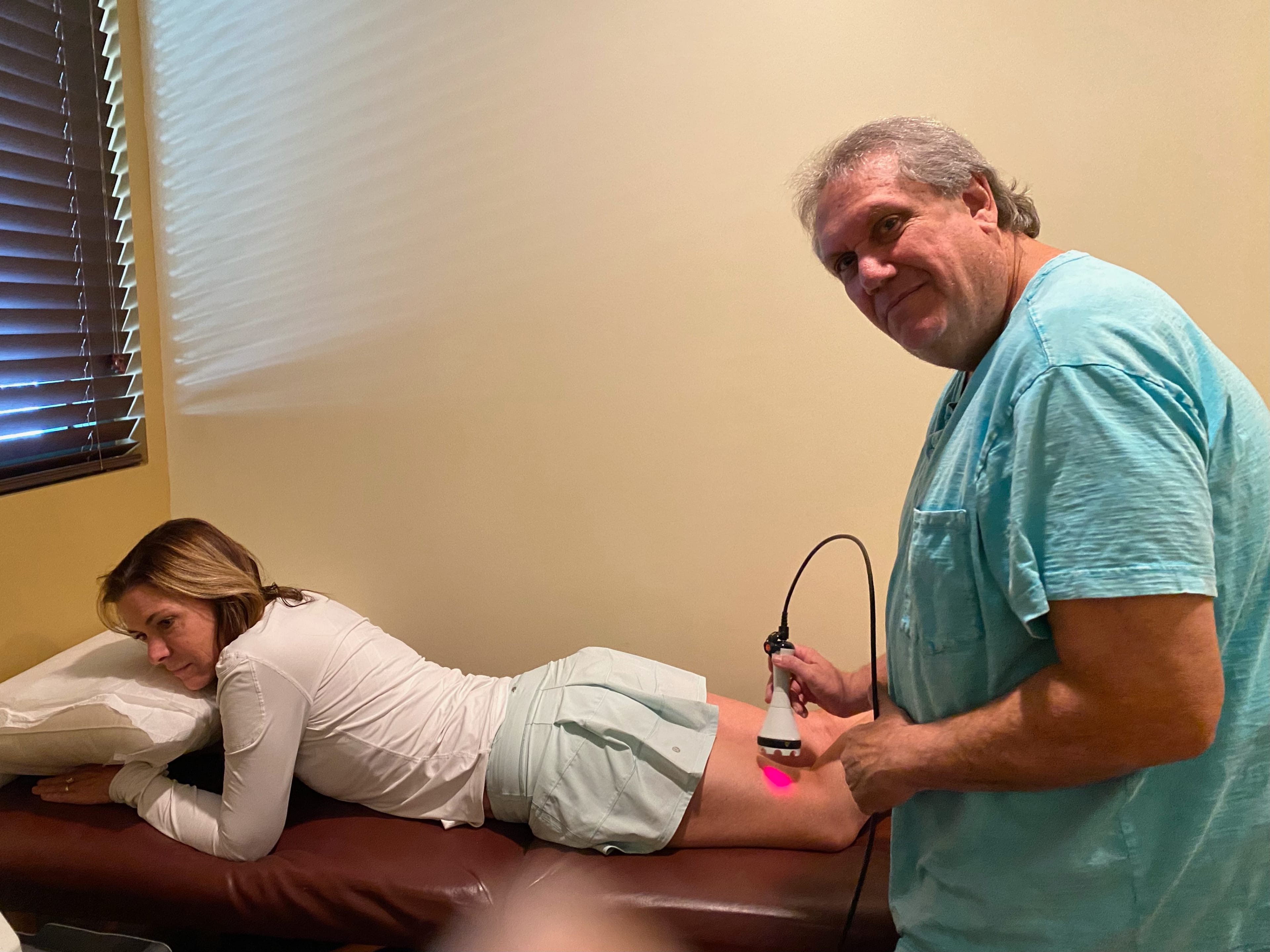Dr. Corvin performing sciatica diagnostic assessment at Windmill Health Center